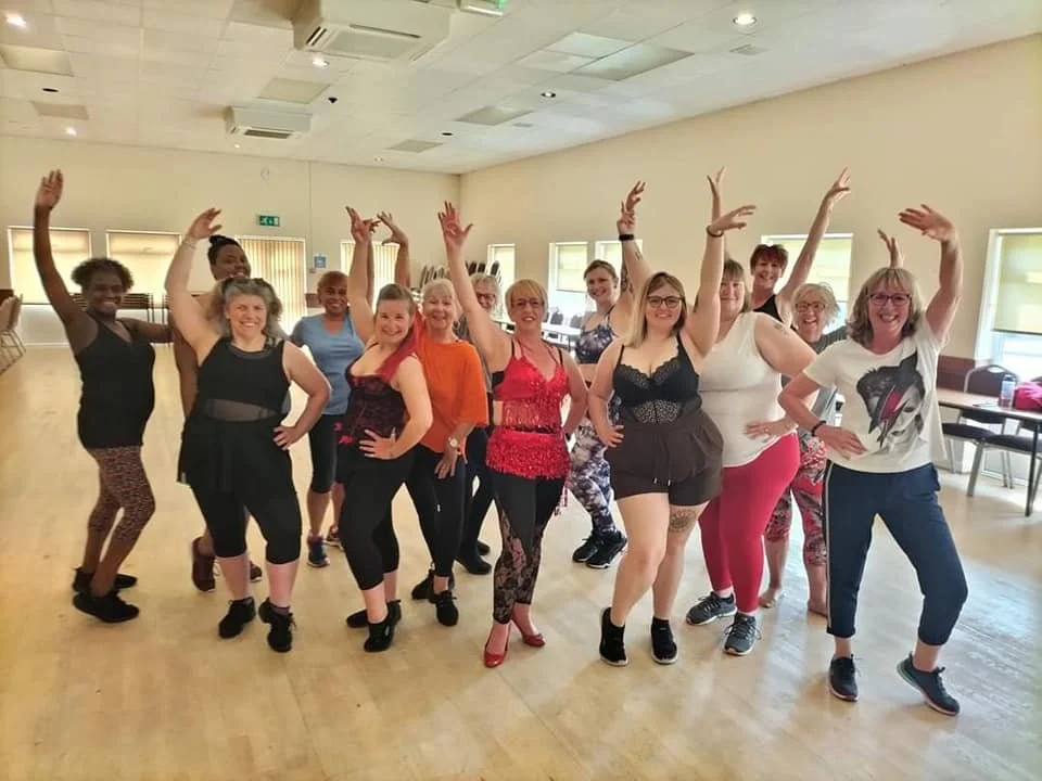 Bumba Lesque workshop group striking a pose
