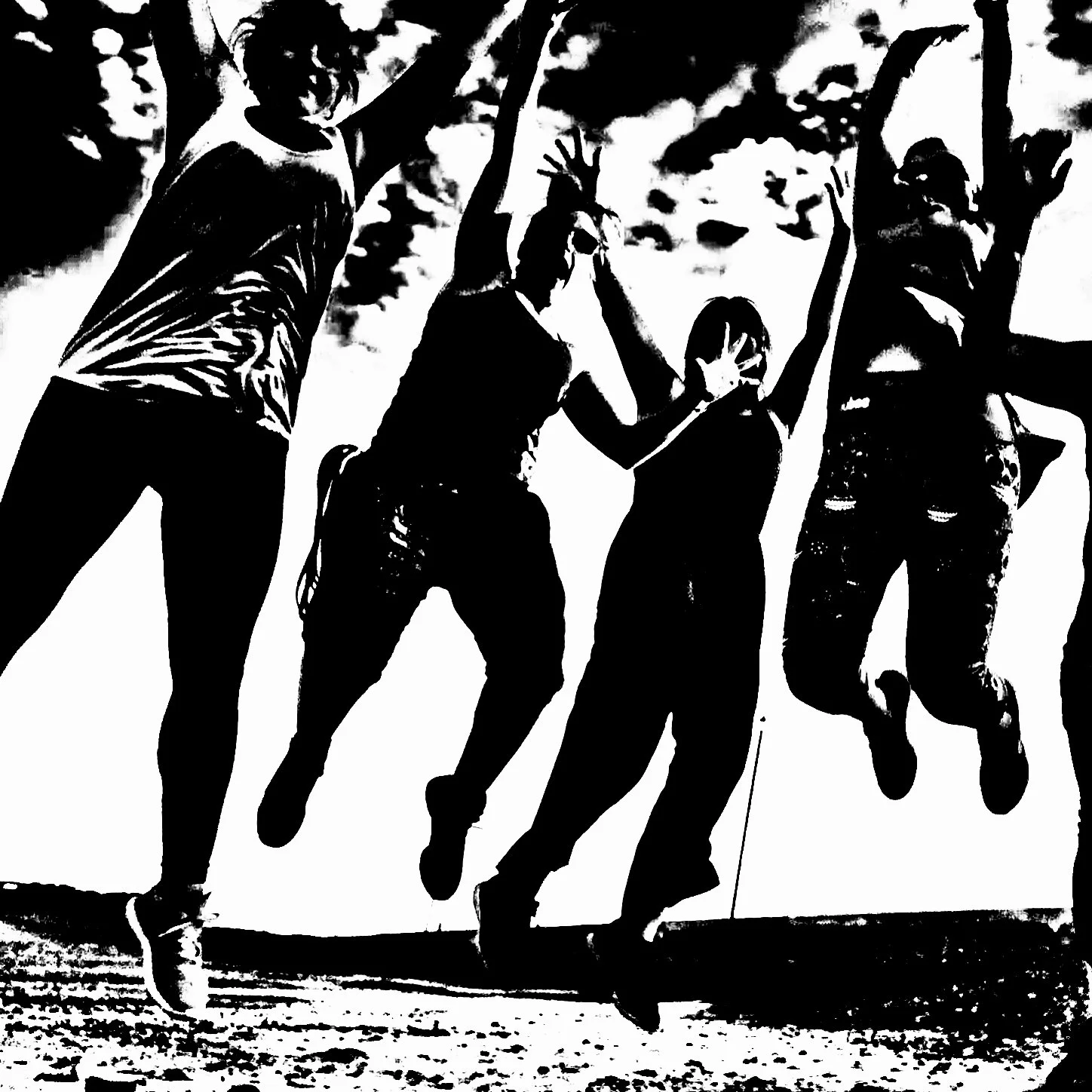 Dancers jumping at a silent beach rave